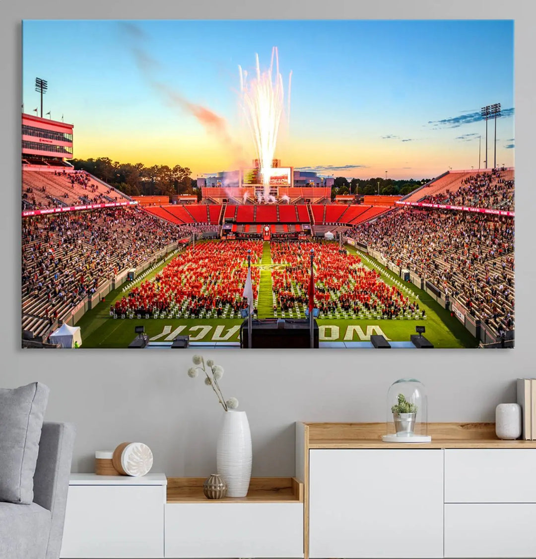 Experience the vibrant atmosphere of a packed crowd, an impressive field display, and dazzling fireworks at sunset in this artwork titled "North Carolina State University Wolfpack Football Team Print - Raleigh Carter-Finley Stadium." This scene is beautifully captured on a canvas print.