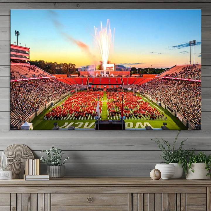 Experience the vibrant atmosphere of a packed crowd, an impressive field display, and dazzling fireworks at sunset in this artwork titled "North Carolina State University Wolfpack Football Team Print - Raleigh Carter-Finley Stadium." This scene is beautifully captured on a canvas print.