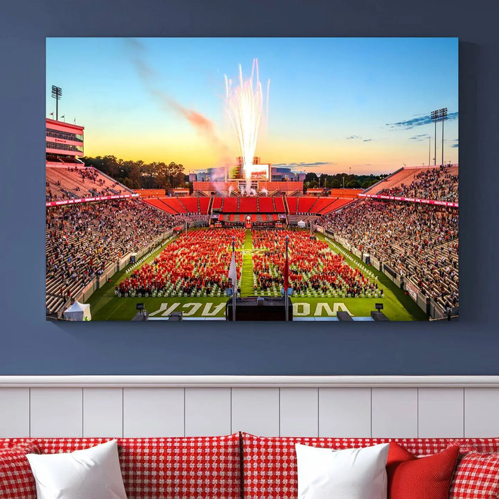 Experience the vibrant atmosphere of a packed crowd, an impressive field display, and dazzling fireworks at sunset in this artwork titled "North Carolina State University Wolfpack Football Team Print - Raleigh Carter-Finley Stadium." This scene is beautifully captured on a canvas print.