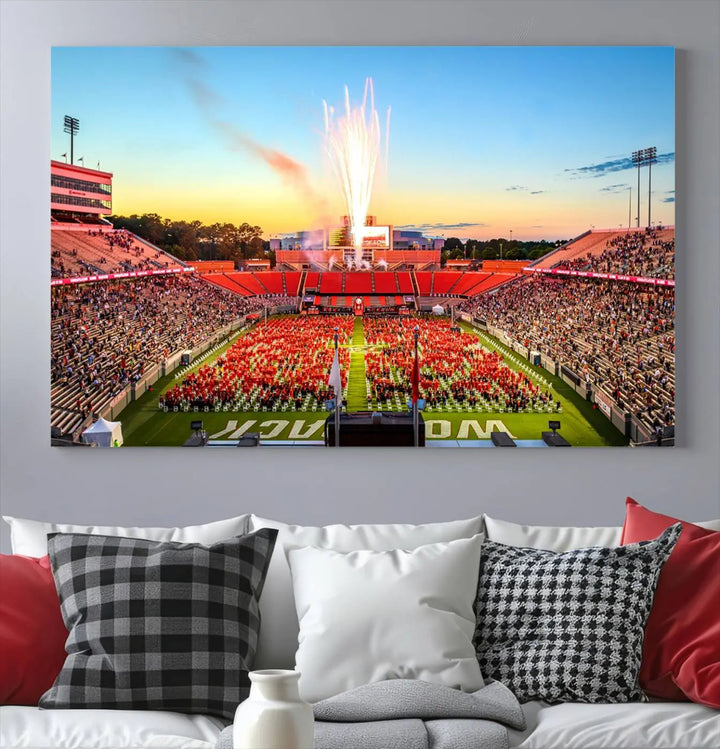 Experience the vibrant atmosphere of a packed crowd, an impressive field display, and dazzling fireworks at sunset in this artwork titled "North Carolina State University Wolfpack Football Team Print - Raleigh Carter-Finley Stadium." This scene is beautifully captured on a canvas print.