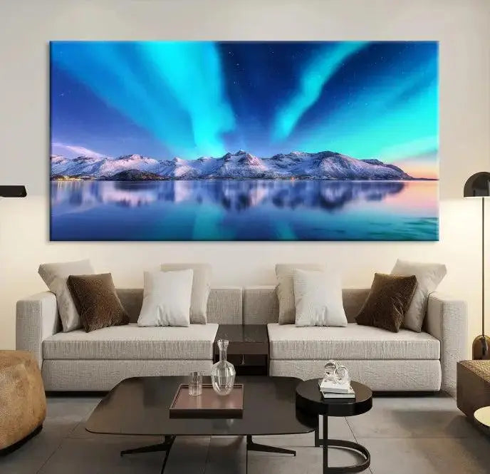 The room features the "Northern Lights above Mountain Wall Art Canvas Print," showcasing a triptych of the aurora borealis over snowy mountains and a lake. Professionally crafted frames on museum-quality canvases are highlighted in the modern decor.