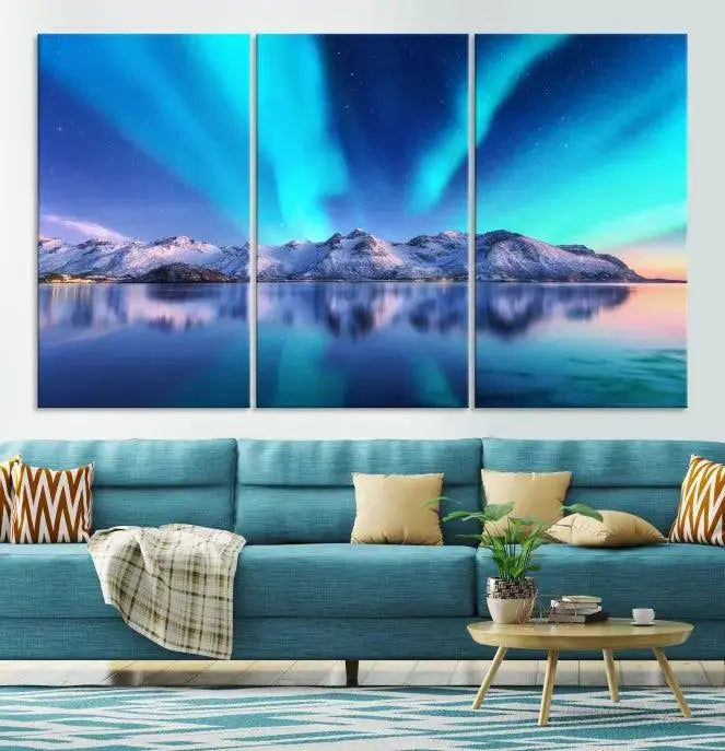 The room features the "Northern Lights above Mountain Wall Art Canvas Print," showcasing a triptych of the aurora borealis over snowy mountains and a lake. Professionally crafted frames on museum-quality canvases are highlighted in the modern decor.