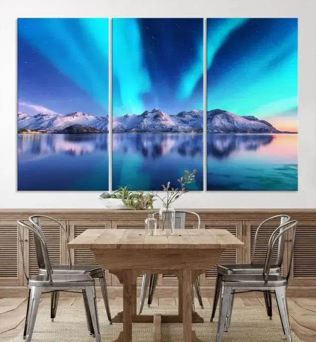 The room features the "Northern Lights above Mountain Wall Art Canvas Print," showcasing a triptych of the aurora borealis over snowy mountains and a lake. Professionally crafted frames on museum-quality canvases are highlighted in the modern decor.