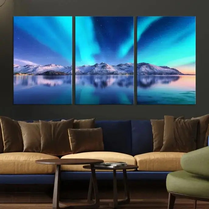 The room features the "Northern Lights above Mountain Wall Art Canvas Print," showcasing a triptych of the aurora borealis over snowy mountains and a lake. Professionally crafted frames on museum-quality canvases are highlighted in the modern decor.