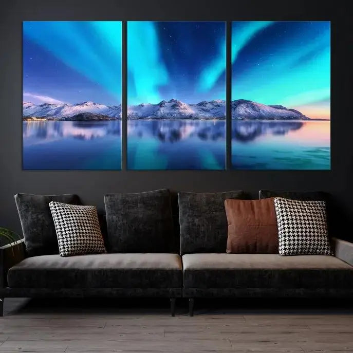 The room features the "Northern Lights above Mountain Wall Art Canvas Print," showcasing a triptych of the aurora borealis over snowy mountains and a lake. Professionally crafted frames on museum-quality canvases are highlighted in the modern decor.