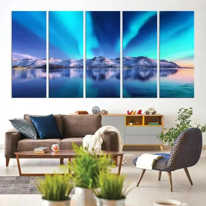 The room features the "Northern Lights above Mountain Wall Art Canvas Print," showcasing a triptych of the aurora borealis over snowy mountains and a lake. Professionally crafted frames on museum-quality canvases are highlighted in the modern decor.