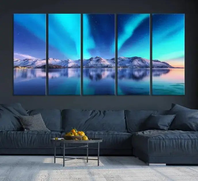 The room features the "Northern Lights above Mountain Wall Art Canvas Print," showcasing a triptych of the aurora borealis over snowy mountains and a lake. Professionally crafted frames on museum-quality canvases are highlighted in the modern decor.