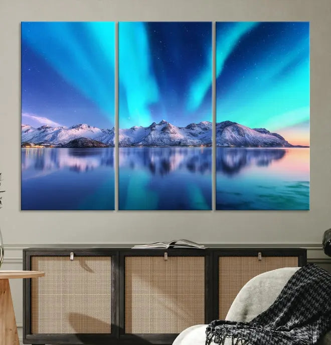 The room features the "Northern Lights above Mountain Wall Art Canvas Print," showcasing a triptych of the aurora borealis over snowy mountains and a lake. Professionally crafted frames on museum-quality canvases are highlighted in the modern decor.