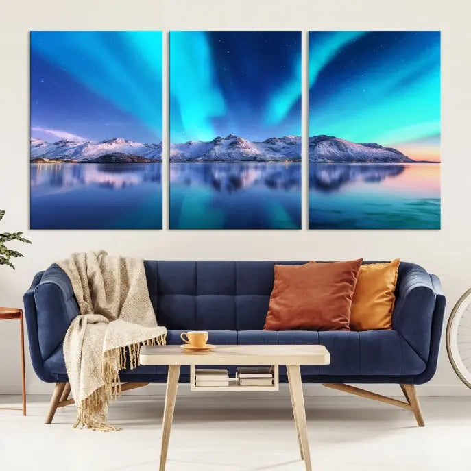 The room features the "Northern Lights above Mountain Wall Art Canvas Print," showcasing a triptych of the aurora borealis over snowy mountains and a lake. Professionally crafted frames on museum-quality canvases are highlighted in the modern decor.