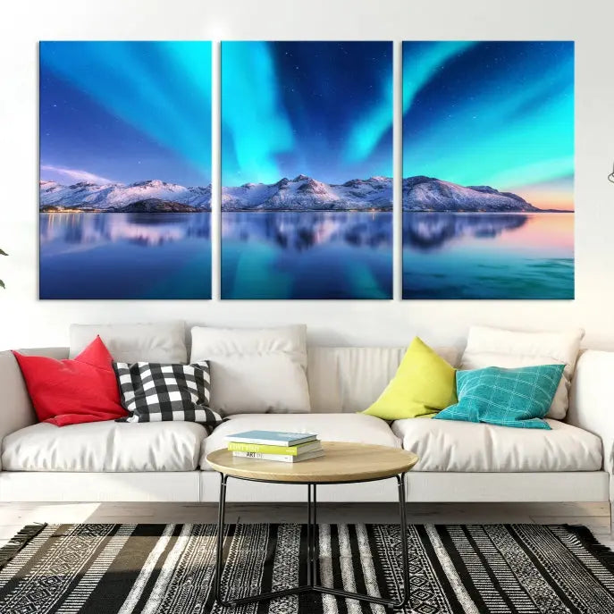 The room features the "Northern Lights above Mountain Wall Art Canvas Print," showcasing a triptych of the aurora borealis over snowy mountains and a lake. Professionally crafted frames on museum-quality canvases are highlighted in the modern decor.