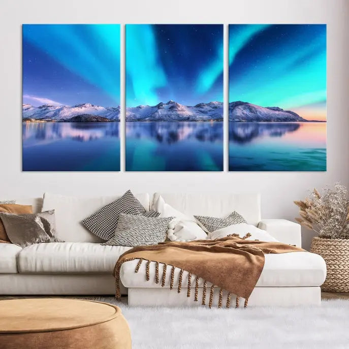 The room features the "Northern Lights above Mountain Wall Art Canvas Print," showcasing a triptych of the aurora borealis over snowy mountains and a lake. Professionally crafted frames on museum-quality canvases are highlighted in the modern decor.