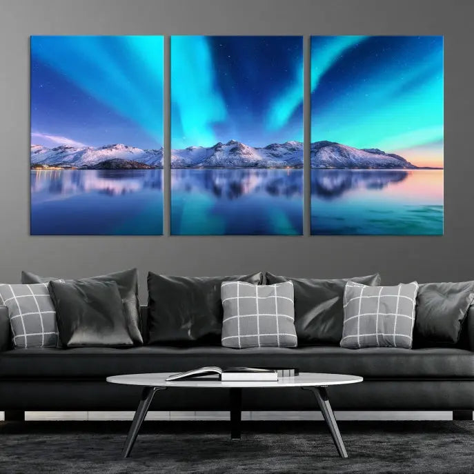 The room features the "Northern Lights above Mountain Wall Art Canvas Print," showcasing a triptych of the aurora borealis over snowy mountains and a lake. Professionally crafted frames on museum-quality canvases are highlighted in the modern decor.