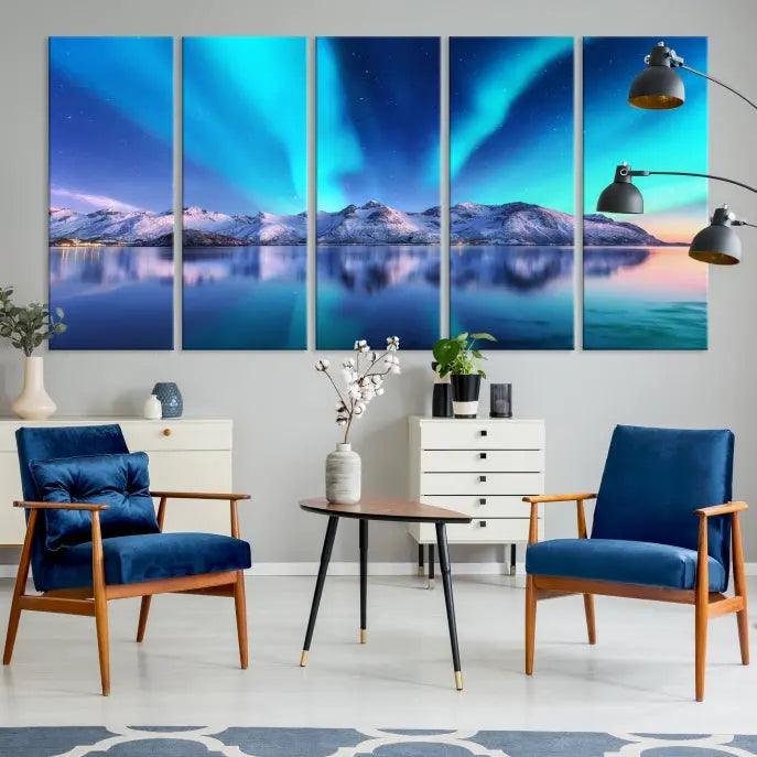 The room features the "Northern Lights above Mountain Wall Art Canvas Print," showcasing a triptych of the aurora borealis over snowy mountains and a lake. Professionally crafted frames on museum-quality canvases are highlighted in the modern decor.