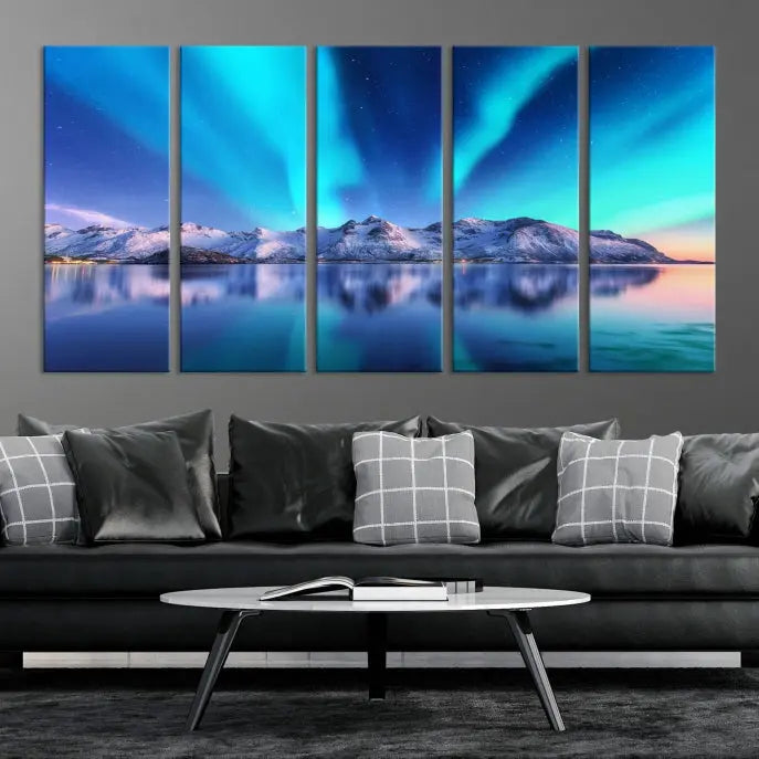 The room features the "Northern Lights above Mountain Wall Art Canvas Print," showcasing a triptych of the aurora borealis over snowy mountains and a lake. Professionally crafted frames on museum-quality canvases are highlighted in the modern decor.