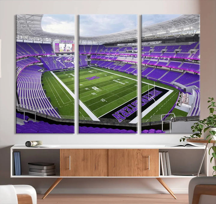 A Northwestern University Wildcats Football Team print of Evanston Ryan Field, featuring a purple-themed football stadium, elegantly hangs on the wall. This wall art boasts a gallery-quality finish on premium canvas to add sophistication to any space.