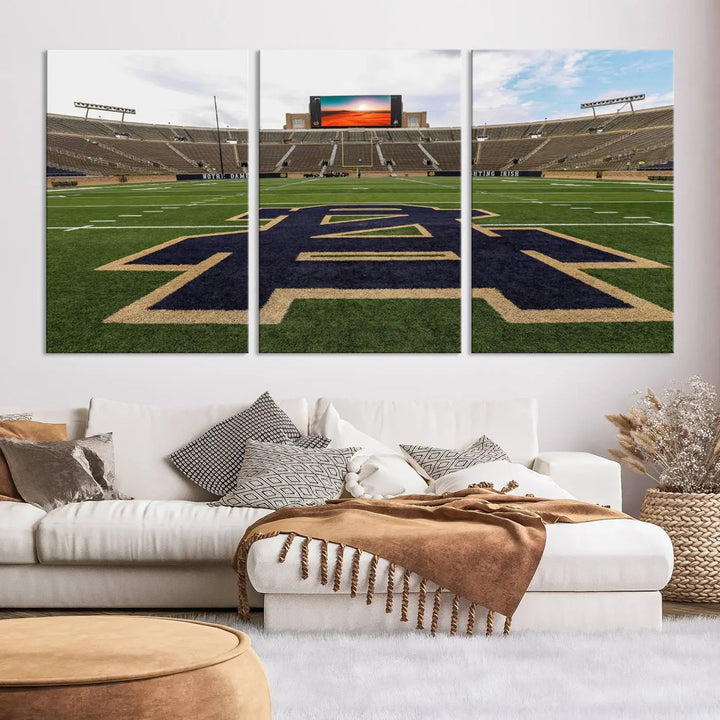 The Notre Dame Stadium Giclee Canvas Print, a triptych wall art featuring the iconic Notre Dame football field, beautifully adorns a modern living room—perfect for fans of legendary venues.