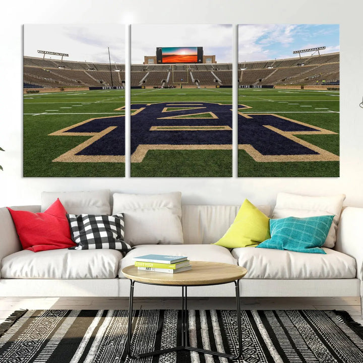 The Notre Dame Stadium Giclee Canvas Print, a triptych wall art featuring the iconic Notre Dame football field, beautifully adorns a modern living room—perfect for fans of legendary venues.