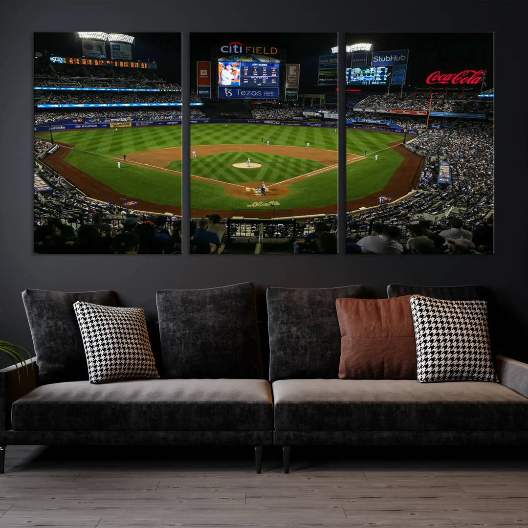 The "Oakland Athletics Baseball Team Print - RingCentral Coliseum Stadium Wall Art Canvas Print" elegantly adorns a modern living room. This stunning three-panel artwork of a baseball stadium at night is crafted on museum-quality canvas, ensuring its vibrant beauty endures over time.