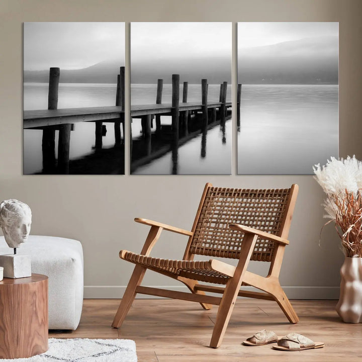 The "Ocean Beach Canvas Wall Art" is a black-and-white triptych depicting a serene dock over water.