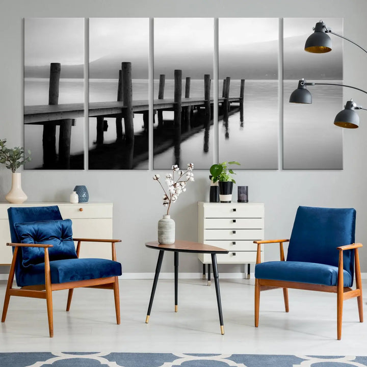 The "Ocean Beach Canvas Wall Art" is a black-and-white triptych depicting a serene dock over water.