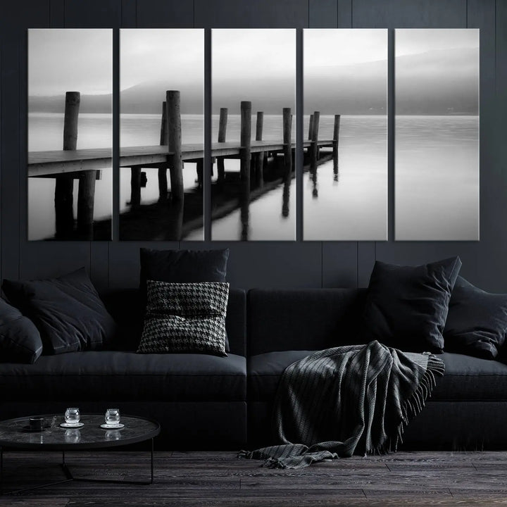 The "Ocean Beach Canvas Wall Art" is a black-and-white triptych depicting a serene dock over water.