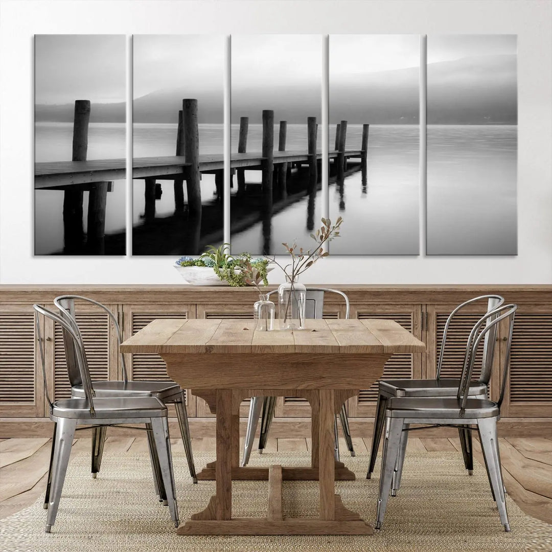 The "Ocean Beach Canvas Wall Art" is a black-and-white triptych depicting a serene dock over water.