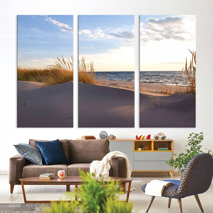 The living room showcases the Ocean Beach Wall Art Canvas Print Sunset Artwork Print Coastal Wall Art—a triptych wall art featuring a beach scene at sunset. Each museum-quality canvas piece is ready to hang and includes a UV-protective coating to preserve its stunning beauty.