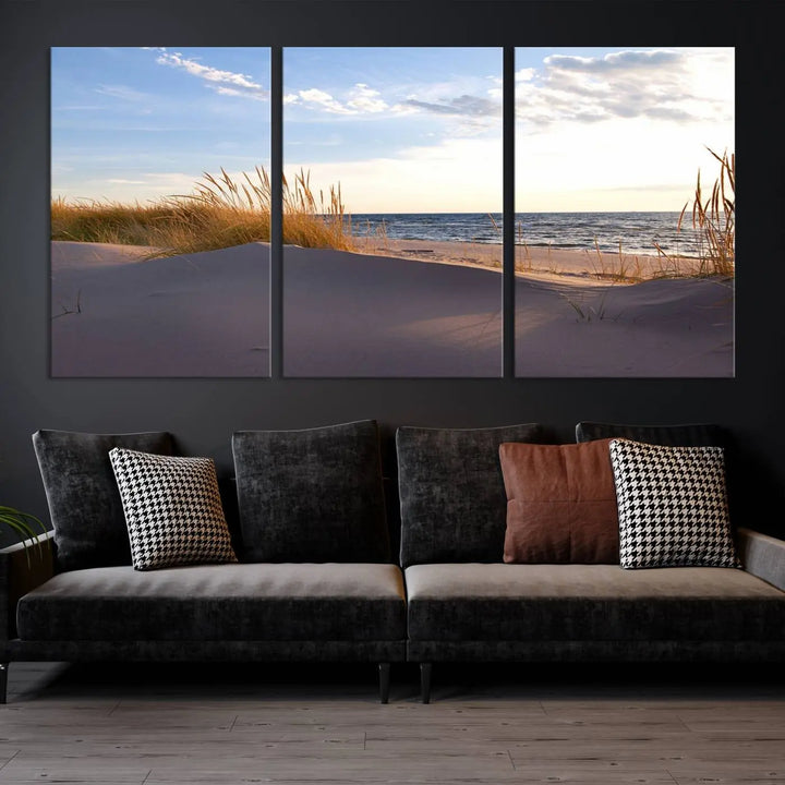 The living room showcases the Ocean Beach Wall Art Canvas Print Sunset Artwork Print Coastal Wall Art—a triptych wall art featuring a beach scene at sunset. Each museum-quality canvas piece is ready to hang and includes a UV-protective coating to preserve its stunning beauty.