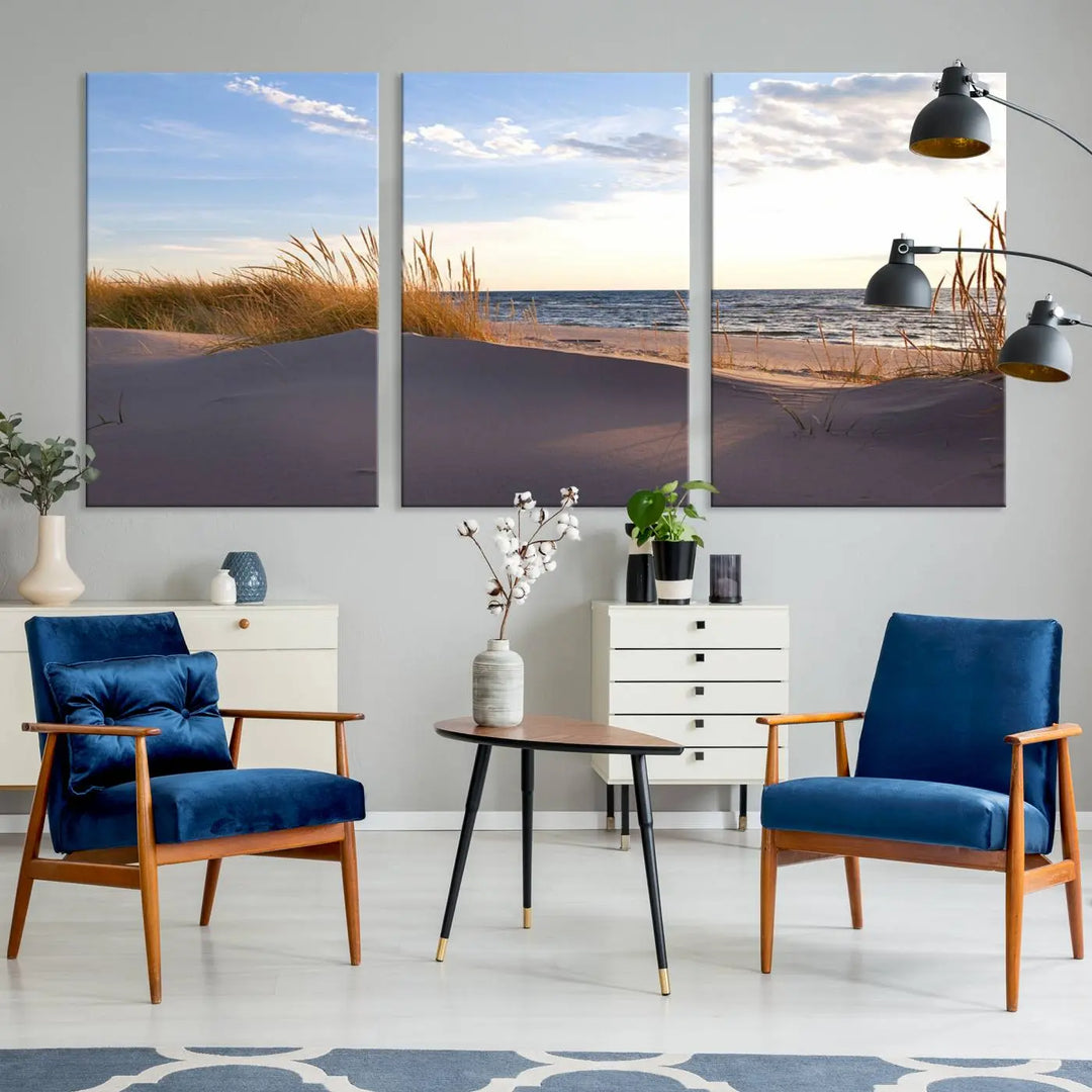 The living room showcases the Ocean Beach Wall Art Canvas Print Sunset Artwork Print Coastal Wall Art—a triptych wall art featuring a beach scene at sunset. Each museum-quality canvas piece is ready to hang and includes a UV-protective coating to preserve its stunning beauty.