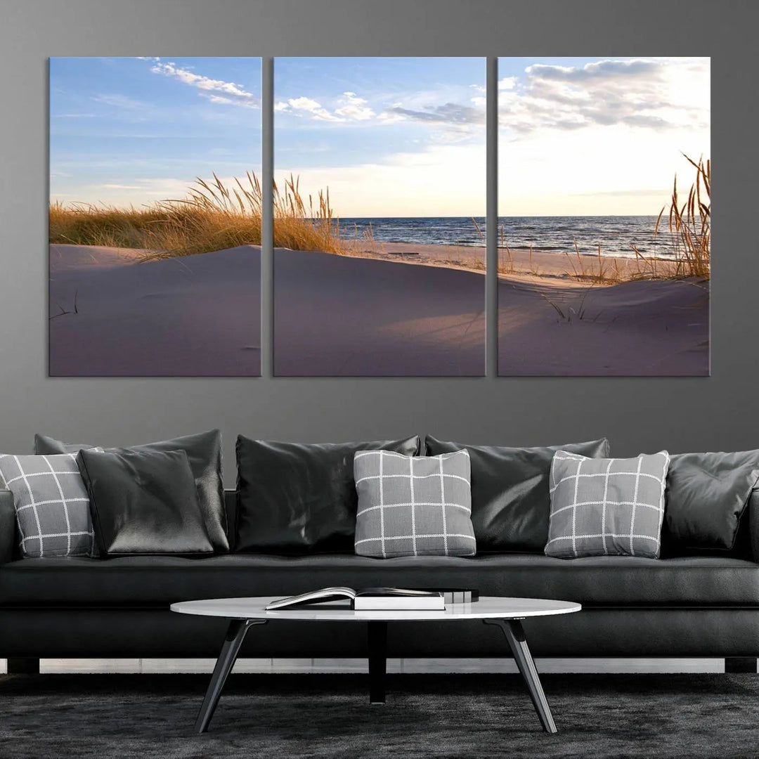 The living room showcases the Ocean Beach Wall Art Canvas Print Sunset Artwork Print Coastal Wall Art—a triptych wall art featuring a beach scene at sunset. Each museum-quality canvas piece is ready to hang and includes a UV-protective coating to preserve its stunning beauty.