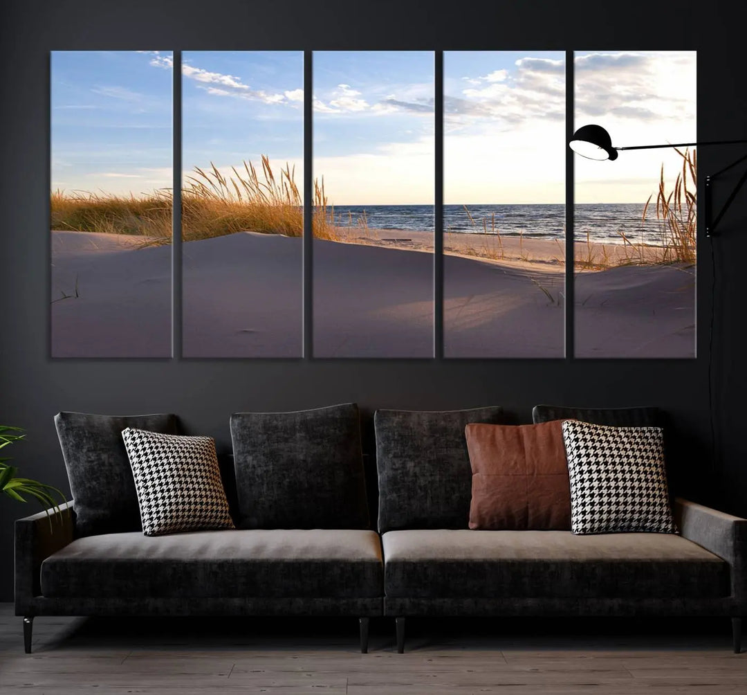 The living room showcases the Ocean Beach Wall Art Canvas Print Sunset Artwork Print Coastal Wall Art—a triptych wall art featuring a beach scene at sunset. Each museum-quality canvas piece is ready to hang and includes a UV-protective coating to preserve its stunning beauty.