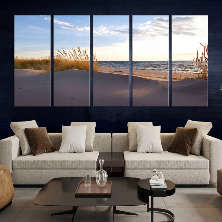 The living room showcases the Ocean Beach Wall Art Canvas Print Sunset Artwork Print Coastal Wall Art—a triptych wall art featuring a beach scene at sunset. Each museum-quality canvas piece is ready to hang and includes a UV-protective coating to preserve its stunning beauty.