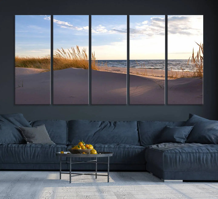 The living room showcases the Ocean Beach Wall Art Canvas Print Sunset Artwork Print Coastal Wall Art—a triptych wall art featuring a beach scene at sunset. Each museum-quality canvas piece is ready to hang and includes a UV-protective coating to preserve its stunning beauty.