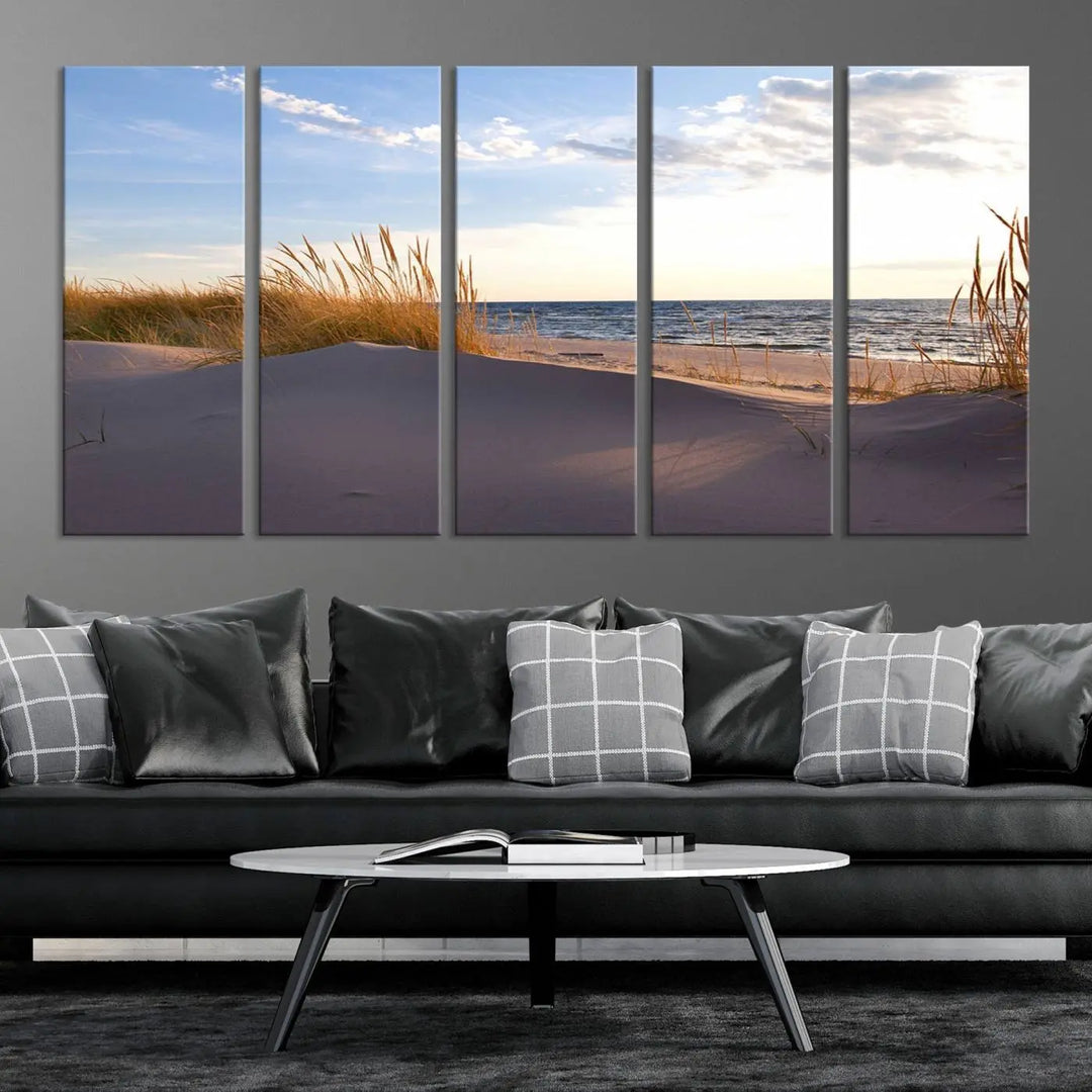 The living room showcases the Ocean Beach Wall Art Canvas Print Sunset Artwork Print Coastal Wall Art—a triptych wall art featuring a beach scene at sunset. Each museum-quality canvas piece is ready to hang and includes a UV-protective coating to preserve its stunning beauty.