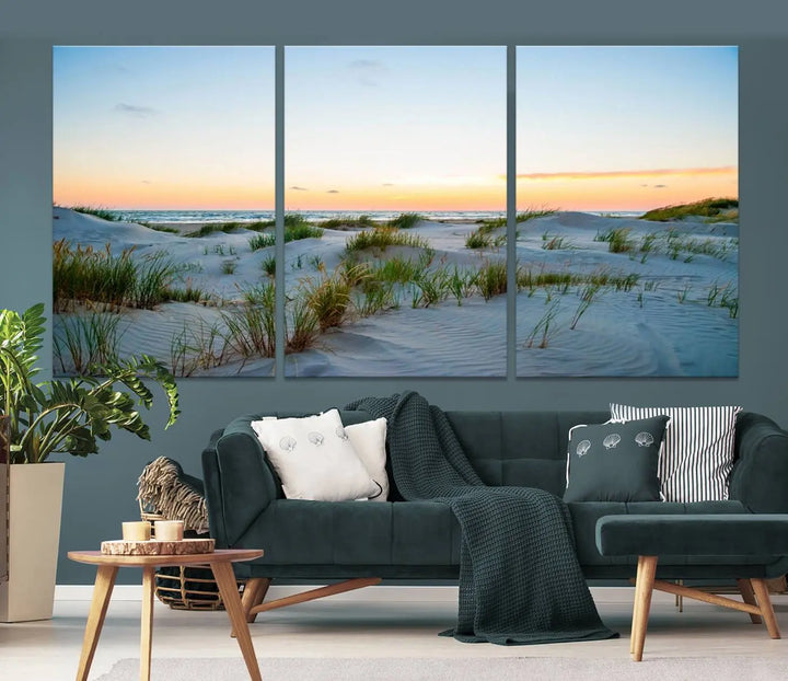 The "Ocean Beach Wall Art Canvas Print Sunset Artwork Print Coastal Wall Art" brings a sense of tranquility to the space. Crafted on museum-quality canvas and featuring gallery-wrapped edges, this modern living room piece is protected by a UV coating to ensure its lasting beauty.