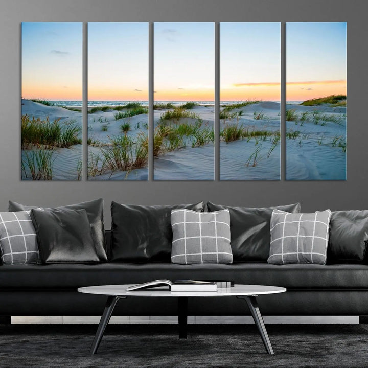 The "Ocean Beach Wall Art Canvas Print Sunset Artwork Print Coastal Wall Art" brings a sense of tranquility to the space. Crafted on museum-quality canvas and featuring gallery-wrapped edges, this modern living room piece is protected by a UV coating to ensure its lasting beauty.