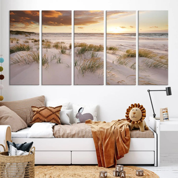 A triptych of the Ocean Beach Wall Art Canvas Print Sunset Artwork Print Coastal Wall Art showcases a serene beach landscape with sand dunes and grasses, gallery wrapped on museum-quality canvas.