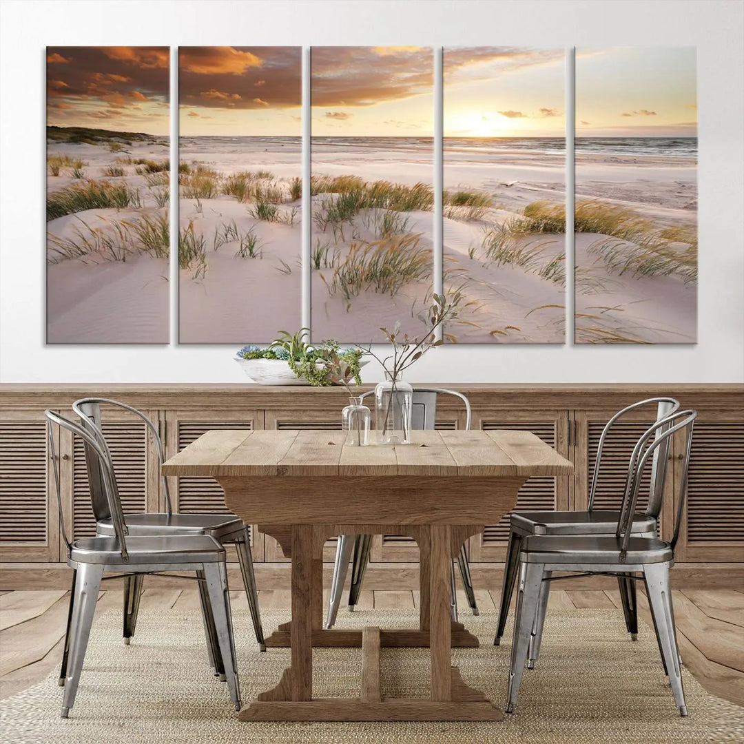 A triptych of the Ocean Beach Wall Art Canvas Print Sunset Artwork Print Coastal Wall Art showcases a serene beach landscape with sand dunes and grasses, gallery wrapped on museum-quality canvas.