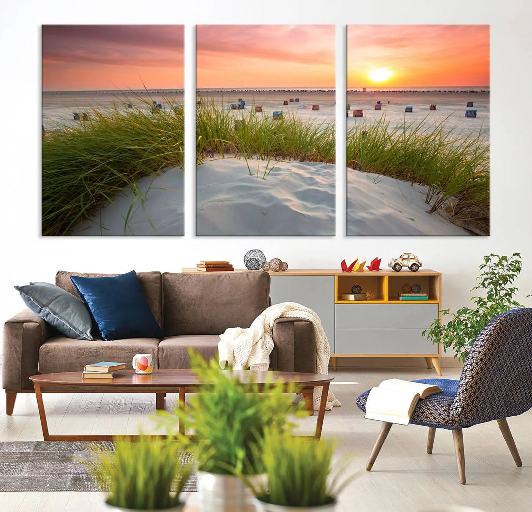 The Ocean Beach Wall Art Canvas Print beautifully captures a sunset over the beach and adds a coastal decor vibe to the space.