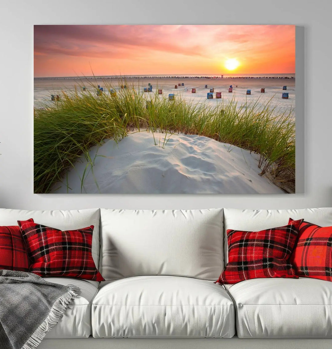 The Ocean Beach Wall Art Canvas Print beautifully captures a sunset over the beach and adds a coastal decor vibe to the space.