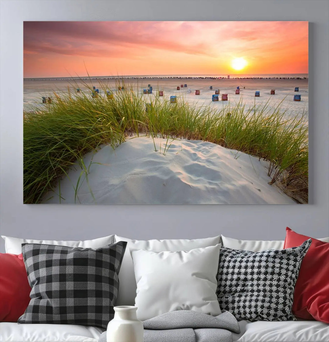 The Ocean Beach Wall Art Canvas Print beautifully captures a sunset over the beach and adds a coastal decor vibe to the space.