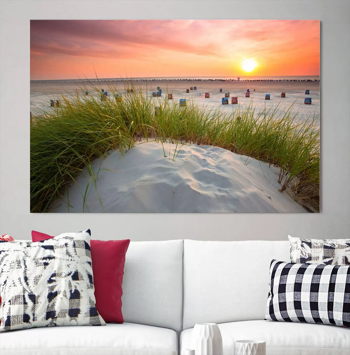 The Ocean Beach Wall Art Canvas Print beautifully captures a sunset over the beach and adds a coastal decor vibe to the space.