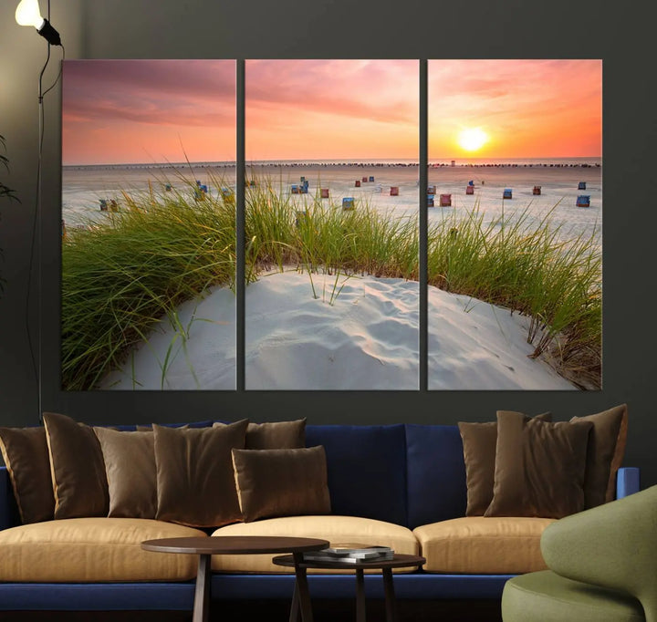 The Ocean Beach Wall Art Canvas Print beautifully captures a sunset over the beach and adds a coastal decor vibe to the space.