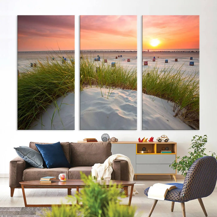 The Ocean Beach Wall Art Canvas Print beautifully captures a sunset over the beach and adds a coastal decor vibe to the space.