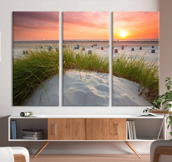 The Ocean Beach Wall Art Canvas Print beautifully captures a sunset over the beach and adds a coastal decor vibe to the space.