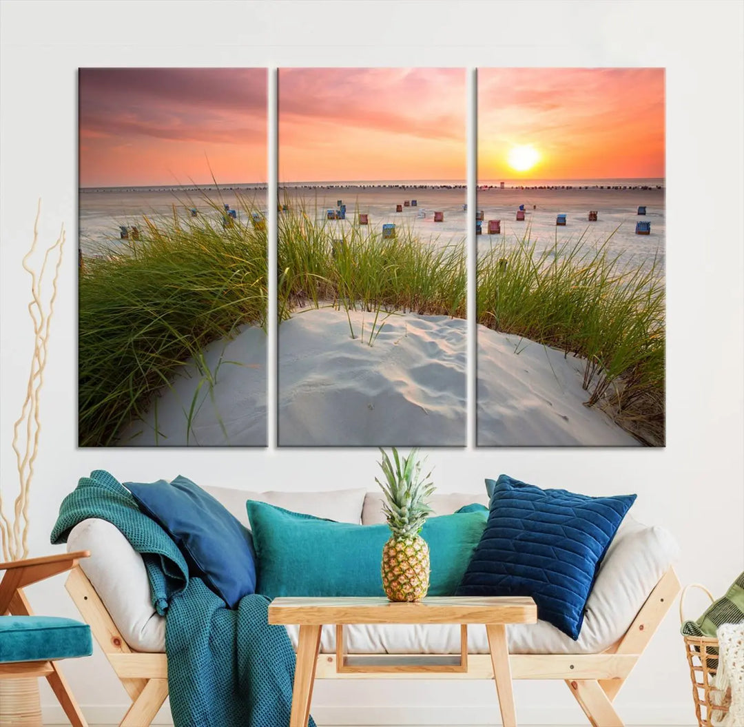 The Ocean Beach Wall Art Canvas Print beautifully captures a sunset over the beach and adds a coastal decor vibe to the space.