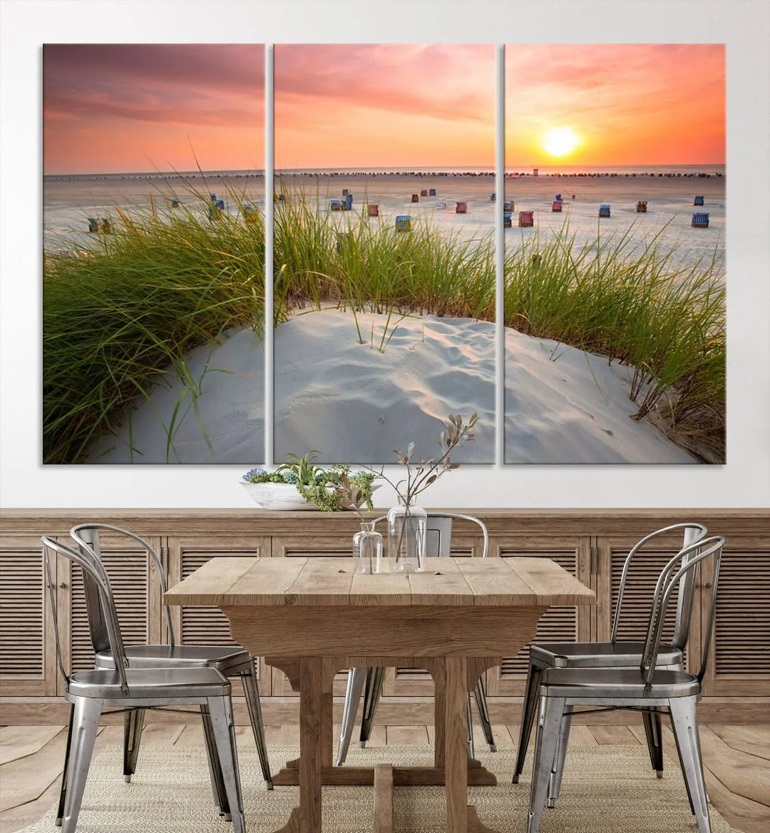 The Ocean Beach Wall Art Canvas Print beautifully captures a sunset over the beach and adds a coastal decor vibe to the space.