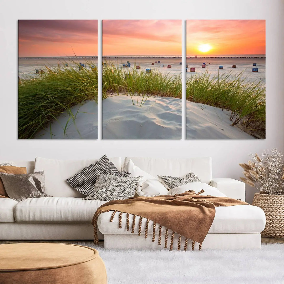 The Ocean Beach Wall Art Canvas Print beautifully captures a sunset over the beach and adds a coastal decor vibe to the space.