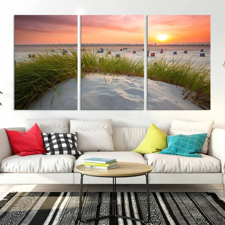 The Ocean Beach Wall Art Canvas Print beautifully captures a sunset over the beach and adds a coastal decor vibe to the space.