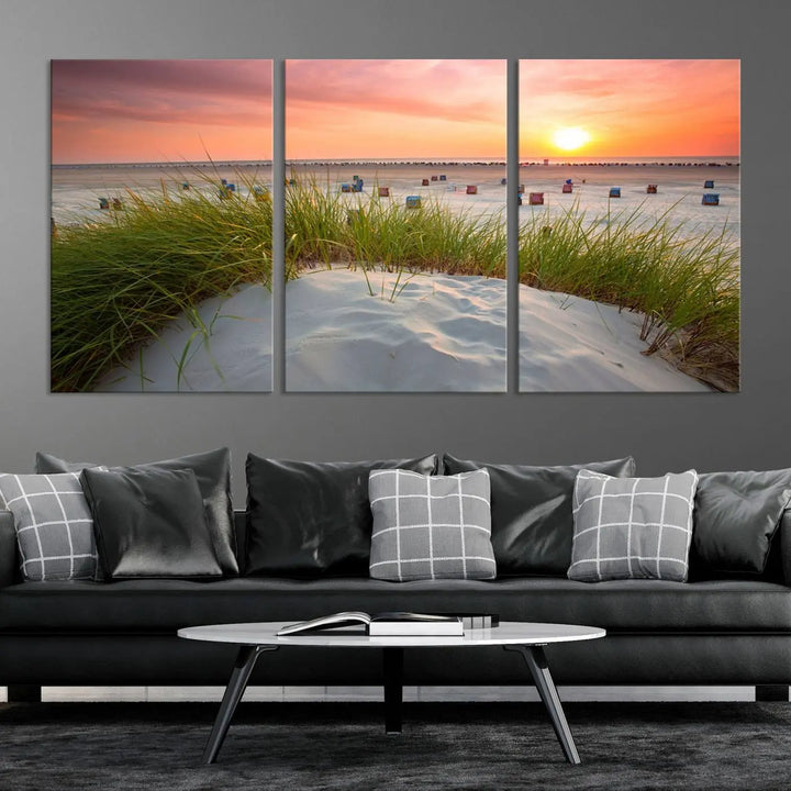 The Ocean Beach Wall Art Canvas Print beautifully captures a sunset over the beach and adds a coastal decor vibe to the space.